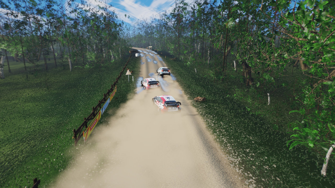 Three-car pack chase with two-phase gravel roost and backlit silt wake