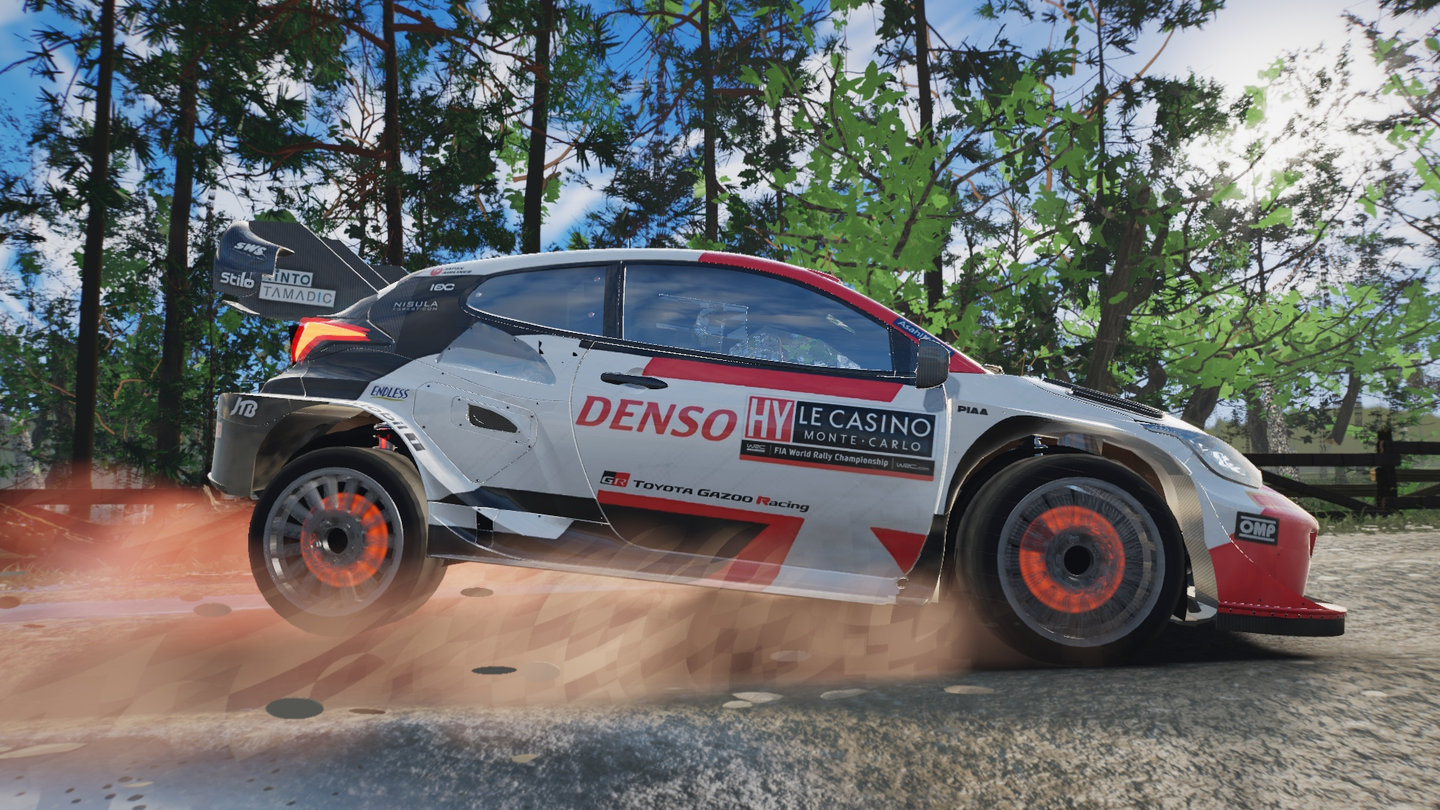 Full 1920x1080 side profile under 48% braking showing forward suspension dive, steered front wheel, and 12-pass 3D wheel blur